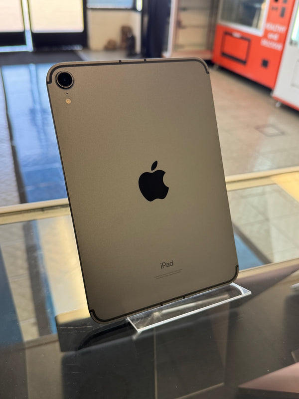 Back view of an iPad on a stand with a blurred indoor background