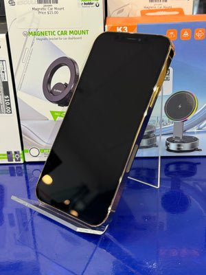 Smartphone on a clear stand with magnetic car mount packaging in the background
