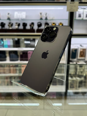 Smartphone with reflective surface showing blurred store interior