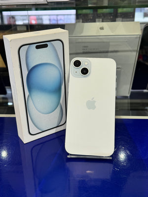 White smartphone next to its packaging on a reflective surface
