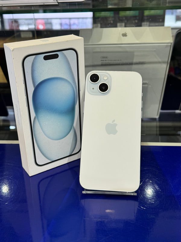 White smartphone next to its packaging on a reflective surface
