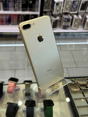 Gold iPhone 7 Plus on display in a store with blurred background
