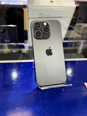 Silver iPhone 11 Pro on a blue surface with a blurred background