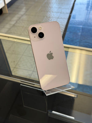 iPhone with Apple logo on a reflective surface