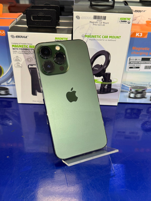 Green smartphone on a stand with magnetic car mount packaging in the background