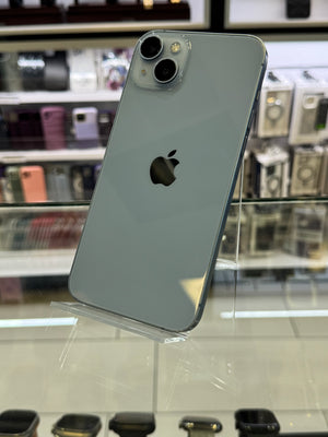 Silver iPhone 11 Pro on display with Apple logo in a store setting