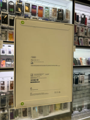 The back of an Apple iPad box displayed in a store setting. 