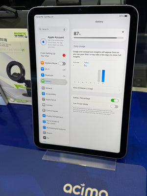 Tablet displaying battery settings on a stand