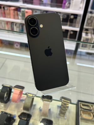 Black smartphone on a stand with blurred store background