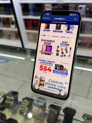 Smartphone displaying a repair shop app on a glass surface with shelves in the background