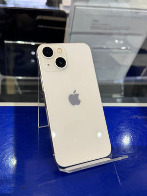 White smartphone with Apple logo on a blue surface