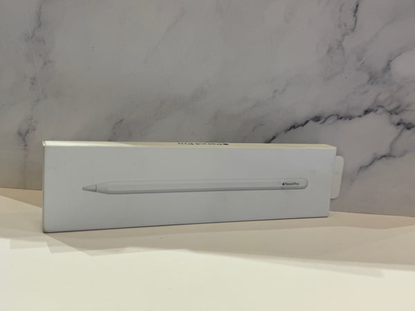 A white Apple Pencil box with the Apple logo and product name printed on the front, resting on a white surface against a gray and white marble-patterned background.