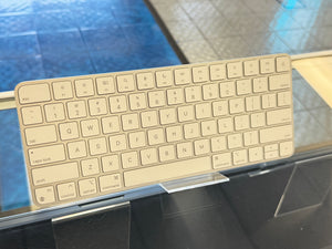 Apple keyboard on a glass surface 