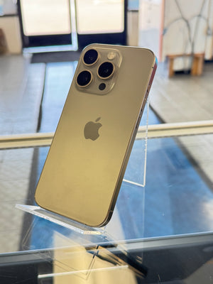 iPhone with Apple logo on a reflective surface