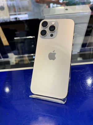 Silver iPhone with Apple logo on a blue surface
