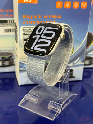 Smartwatch with white band on a blue display stand