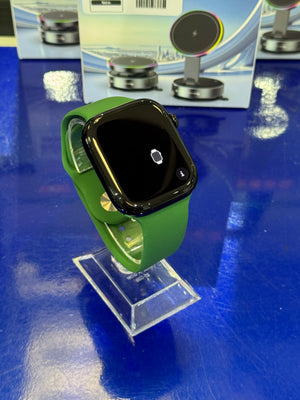 Smartwatch with a green band on a blue surface