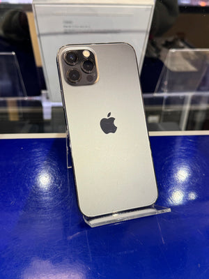 Silver iPhone with Apple logo on a blue surface