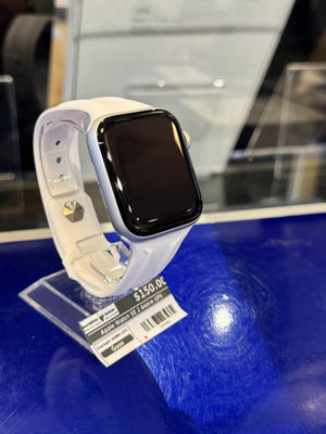 Smartwatch with a label on a blue surface