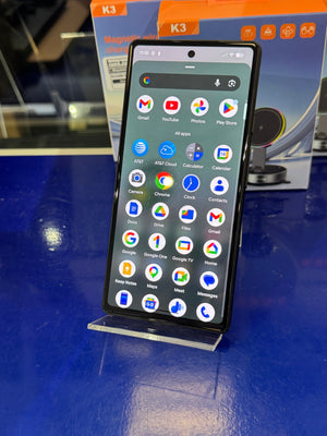 Smartphone with app icons on a blue surface