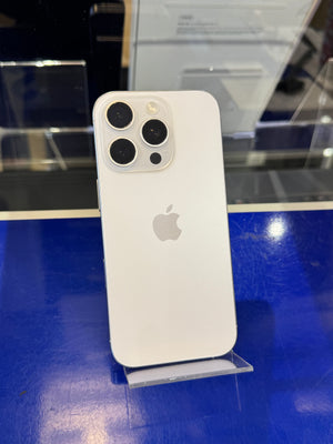 White smartphone with Apple logo on a blue surface