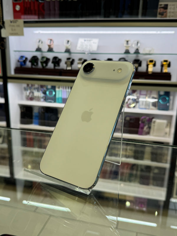 White iPhone on a stand with a blurred background