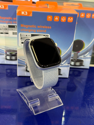 Smartwatch with a grey band on a display stand