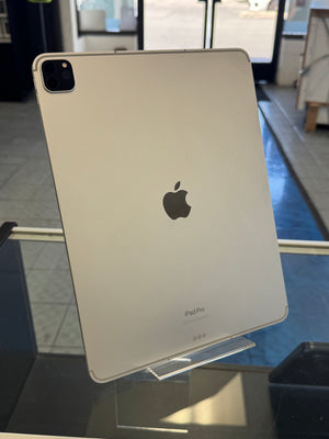 Back view of an Apple iPad Pro on display with a blurred indoor background