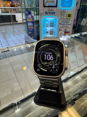 Smartwatch on a stand with a blurred store interior in the background